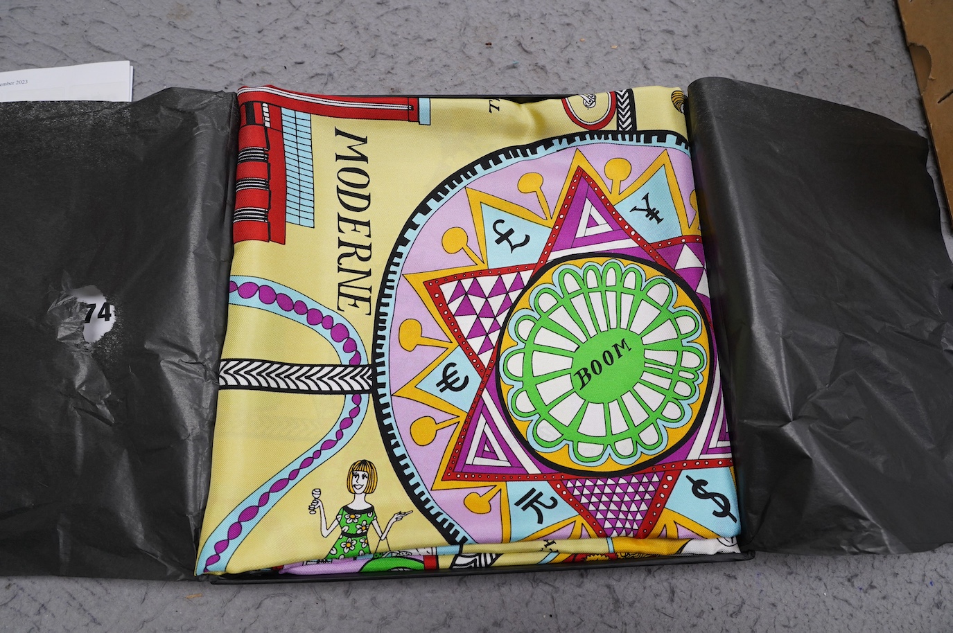 Grayson Perry, silk scarf, in original black Tate box and cellophane cover, scarf 90cm x 90cm. Condition - the interior black tissue paper seal has torn, the scarf looks to be in good condition, black Tate box good, yell